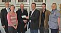 Brian Leather of Heywood Children’s Charities accepts a cheque from Arras People MD John Thorpe Tuesday afternoon in a ceremony. Pictured from left are Dr Michael Taylor; Louise Wileman, HV; Tony Mills of Arras People; and Viv Corcoran, HV Assistant