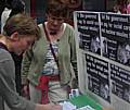 Peace Group member,Patricia Gilligan, looking on as a member of the public signs one of the letters in Yorkshire Street on Saturday