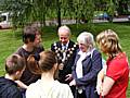 Magician with Mayor and Mayoress of Rochdale with young people looking on