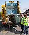 Kayleigh Rush assists a refuse collector on his rounds