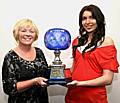 Kathryn Doherty receiving her winner’s award from Liz Barrett