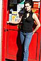 Leanne Wild holds the door of Buersil Post Office open