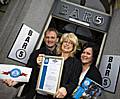 HIGH FIVE: Bar 5 owner Jayne Warcaba (centre) receives her Tidy Business Standards Charter certificate with Rochdale Council’s Gordon Beverly and Rochdale Town Centre Management’s Debbie O’Brien showing their support.