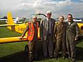 Vinny Haigherty, Paul Rowen MP and a young flyer, Lauren, with pilot Adrian Matthews