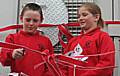 Edenfield Primary School children cut the ribbon to officially open Scout Moor Wind Farm.