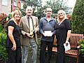 David England picks up the award on behalf of the Wild Street alley from Councillor Ted Flynn, alongside Yvonne Bennett and Diane Alletson from the Alleygating team at Rochdale Council.