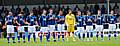 Rochdale's players celebrate Paul Conway's life during a minute's applause during the club's last home game.