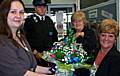 Councillor Jean Ashworth is presented with flowers from Smallbridge Senior Librarian Sue Wellins for her support with the library.