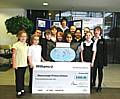 Shawclough Primary School pupils receive their £500 cheque from Williams BMW's Dealer Principal Alex Dunning. 