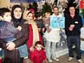 Parents and children meet with garden centre staff

 
