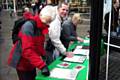 People signing 'Bring Our Troops Home by Christmas' petitions and postcards on Yorkshire Street. 