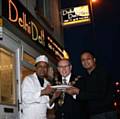 The Mayor of Rochdale Councillor Keith Swift outside Delhi Deli with owner Raja Miah and the Chef.