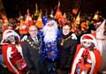 The Mayor and Mayoress of Rochdale with Father Christmas, local residents Pheobe Stagg and Chloe Webster and other young revellers at the Darnhill Christmas Festival.