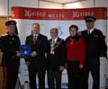 Her Majesty's Lord Lieutenant for Greater Manchester Warren Smith, presents the award to Managing Director David Gilbertson, alongside the Mayor and Mayoress of Rochdale and Chief Inspector George Fawcett