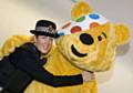 A GMP officer with Pudsey Bear.