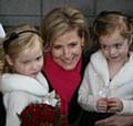 The Countess receives flowers from Middleton twins Katie and Lauren Williams, aged four.