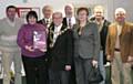 The Mayor of Rochdale, Councillor Keith Swift, presents members of the 'Friends Together' scheme with their award.