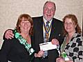 Rotary club President John Kay (centre) presents a £1000 cheque to NSPCC Littleborough District committee members Carol Kennedy and Ged O'Donnell.