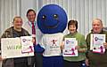 The lucky winners are presented with their prizes by John Pierce, Chairman of NHS HMR, and the Speak Up mascot.