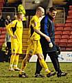 Gary Jones is forced off alongside Dale physio Andy Thorpe in Tuesday night's game at Darlington.