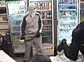 CCTV still showing one of the masked robbers armed with a crook lock.