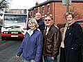 Keep our bus: Councillor Peter Davison flags down a bus with residents Irene Conroy-Goulden, James Goulden and Councillor Pat Flynn