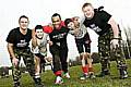 READY for action . . . (from left to right), Sgt Lee Robinson, Elliot Coupe (15), rugby player Austin Buchannon, Jordan Coupe (13) and Cpl Lee Slingsby