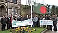 Local dignatories and members of the Bangladeshi community raise the flag at the town hall to celebrate Bangladesh's independence.