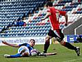 Ciaran Toner challenges Berti Cozic.