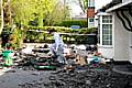 Devastated: Young Rehan looks through the rubble outside his house