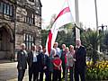 Council leader Councillor Alan Taylor is joined by fellow councillors and members of the public to hoist the flag of St George at the Town Hall today.