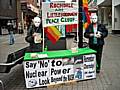 Peace Group members, Mai Chatham and Pat Sanchez wearing masks at the stall on Yorkshire Street on Saturday (25 April).