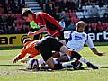 Lee Thorpe gets in a tangle with Jason Pearce and Shwan Jalal.