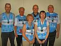 Six members of the Rotarians' team of runners proudly showing off their shirts and medals.  From left to right; Kit Wellens; Norman Wellens; Janice Powell; Keith Trinnaman; Debbie Humphries; Keith Powell.