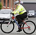 PCSO Jennifer George on the new bike alongside Guinness Northern Counties' Craig Warren and Lorraine Sykes.