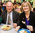 Chief Executive of Rochdale Borough Council, Roger Ellis, tucks into a school dinner