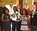 Score: Anthalie Mukambilwa, Axel Tuanzebe and Patricia Diba with their awards