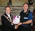 Rochdale town centre ambassadors take their award from the Mayor of Rochdale, Councillor Keith Swift