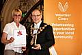 Mal McCall receives her award from Rochdale Mayor Councillor Keith Swift.