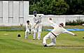 Heywood’s Brendan Taylor slides a shot past the diving Mel Whittle (Oldham).