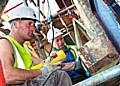 Mick Skinner and his father Vic, restoring stonework on Rochdale terraced homes