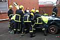 Fire fighters cut the young people out of a car in what could be a real-life situation