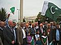 Local dignitaries gather outside the town hall for the raising of the Pakistani flag.