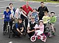 PCSO Dominique Grimes, Chief Superintendent John O’Hare, Dave Godley from Impact Road Safety Unit, resident Anne Mackie and a group of youngsters that took part in the cycle training course.