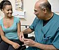 Mr Rip Gangahar, A&E consultant at Rochdale Infirmary with Rochdale patient, Natalie Daley