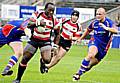 Loose-forward Phil Joseph, who was immense for Oldham, powers his way towards the Hornets line.