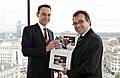 Phil Woolas (right) receives a ballot box containing campaign postcards calling for action to stop irresponsible drinks promotions from Our Life’s head of campaigns and advocacy, Calum Irving.