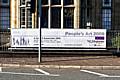 Banner advert on railings outside Touchstones