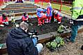 Filming youngsters planting flowers at Darnhill Community Centre.