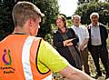 Louise Casey with Rochdale Community Crime Fighters, Richard Rudd and Ghulam Shazad talking with an offender who is cleaning up Taylor Street, Rochdale as part of his Community Payback punishment.